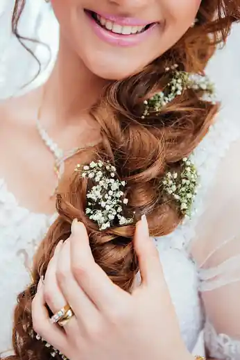 Bride with baby's breath undone updo bridal hair